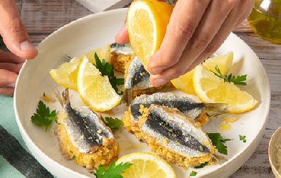 Sarde al forno farcite con pangrattato, prezzemolo e Grana Padano