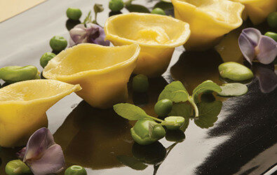 Tortelli al Grana Padano, piselli e fave